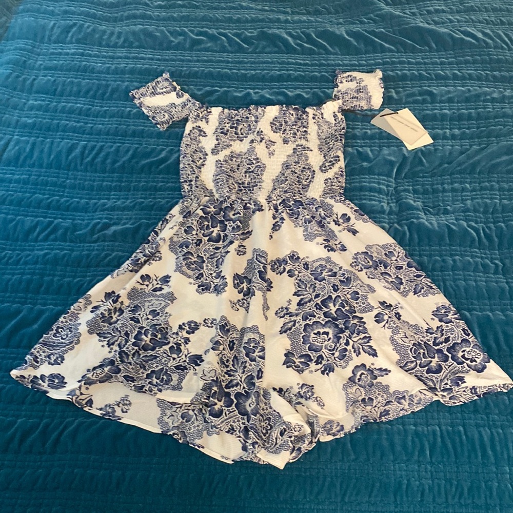 Floral Blue and White Romper. Size Large, never worn before. New with tags.